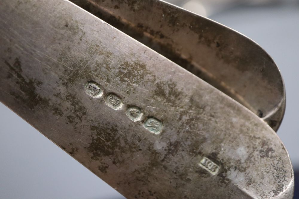 A pair of Victorian silver fiddle pattern basting spoons, London, 1844, A similar silver fish slice & a ladle.
